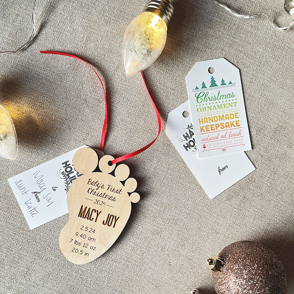 personalized baby&#39;s first christmas ornament with gift tag